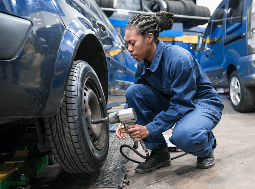 Mechanic working tightening tire nuts